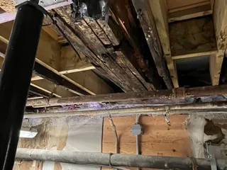 Rotten floor joists before repair at Emerald Lake Lodge Cilantro Building