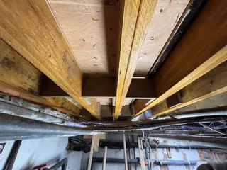 New 2-ply LVL joists being installed in the basement of the Cilantro Building