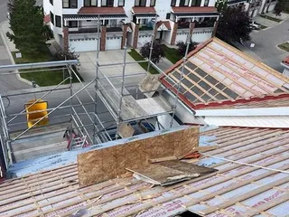 Crew working on the fire-damaged roof structure, Royal Oak NW
