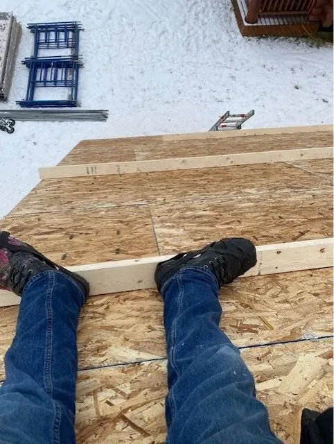 Log cabin roof framing in progress near Golden, BC