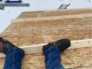 Log cabin roof framing in progress near Golden, BC